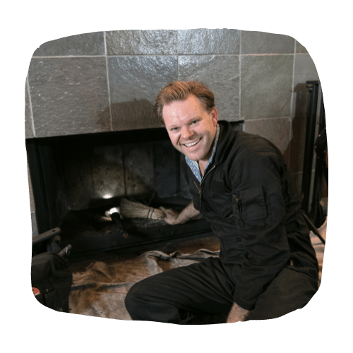 picture of chimney technician clean chimney in omaha, how to contain wood stove heat, chimney sweep
